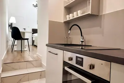 a kitchen with a sink and a counter top at Cozy apartment by Wawel castel - G1b in Kraków