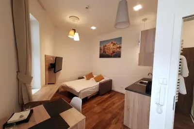 a small room with a bed and a couch in it at Bosacka - old town cozy apartment B16 in Kraków