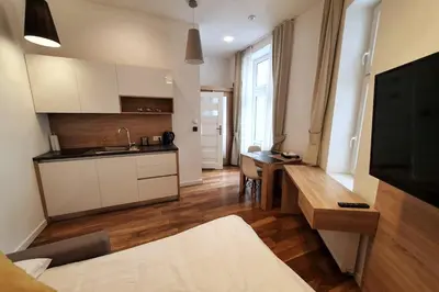 a room with a kitchen and a living room at Bosacka - old town cozy apartment B16 in Kraków