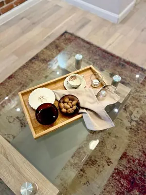 a table with a plate of food on top of it at Vintage Lubicz Apartment in Kraków