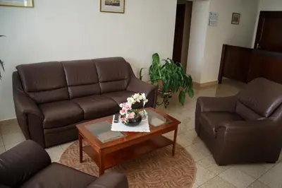 a living room with two couches and a coffee table at Dom rekolekcyjny Vincentinum in Krzeszowice