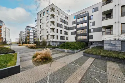 a courtyard with tall buildings in a city at Kazimierz Comfort Flat in Kraków