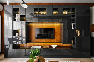 a living room with a flat screen tv on a wall at Kazimierz Comfort Flat in Kraków