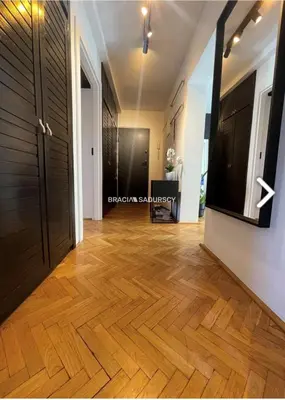 a hallway with wooden flooring in a house at Biały Lotos in Kraków
