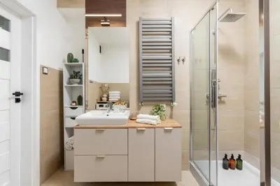 a bathroom with a sink and a shower at Vistula Suite l A Lovely Place to Be in Kraków