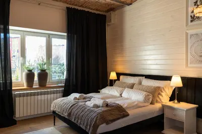 a bedroom with a large bed in front of a window at Villa la Olive Premium Apartaments-Luxury Standard in Oświęcim