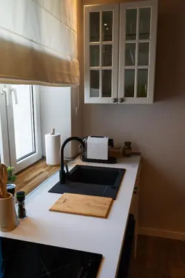 a kitchen with a sink and a counter top at Villa la Olive Premium Apartaments-Luxury Standard in Oświęcim