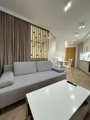 a living room with a couch and a table at Krakow Center Stare Podgorze in Kraków