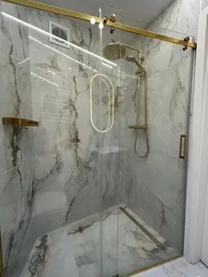 a shower with a glass door in a bathroom at Krakow Center Stare Podgorze in Kraków