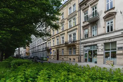 a street in front of a large building at Nowoczesny Apartament w Centrum Krakowa by Noclegi Renters in Kraków