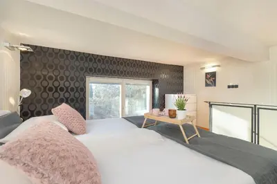 a bedroom with two white beds and a window at Apartament Przyszłości z dwiema sypialniami w Krakowie by Noclegi Renters in Kraków