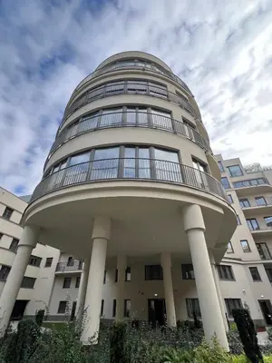 a building with a round top with columns at Cracow Superior Apartment by BookingHost in Kraków