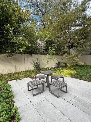a picnic table and four benches on a patio at Cracow Superior Apartment by BookingHost in Kraków