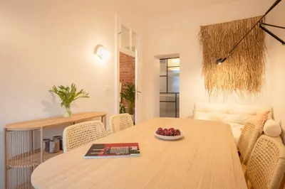 a dining room table with a bowl of fruit on it at Riverside Harmony in Kraków