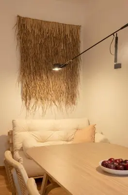 a living room with a table and a couch at Riverside Harmony in Kraków
