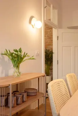 a dining room with a table and chairs at Riverside Harmony in Kraków