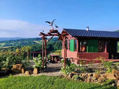 a playground with a swing set in a yard at Agroturystyka Faron in Rozdziele