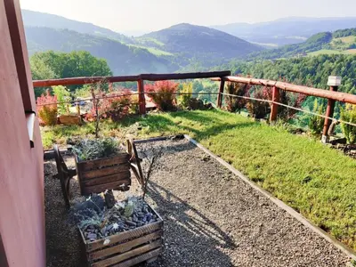 a yard with a swing set in the grass at Agroturystyka Faron in Rozdziele