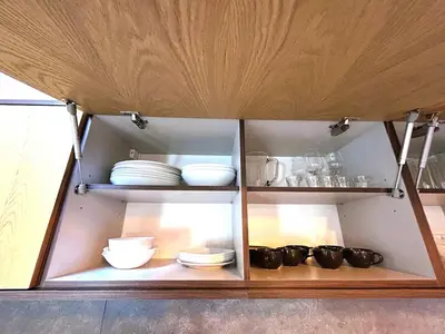 a cabinet with plates and bowls and other dishes in it at Old Town Apt -Bosacka 2 bedrooms B43 in Kraków