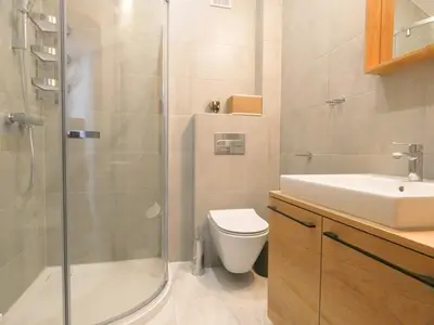 a bathroom with a shower and a toilet and a sink at Old Town Apt -Bosacka 2 bedrooms B43 in Kraków