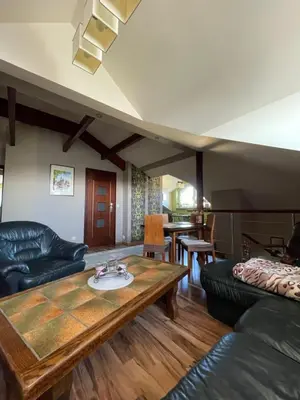 a living room with a couch and a table at Noclegi Weronika in Czajowice