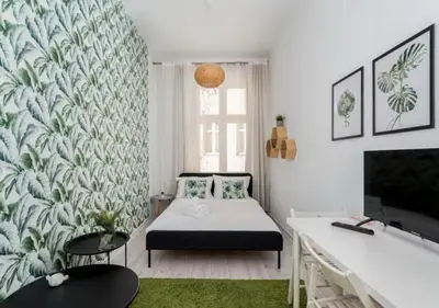 a bedroom with a bed and a green rug at Main Square Heaven Apartment in Kraków