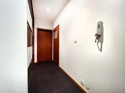 a hallway with a phone on the wall at Apartment in cozy area for 4 guest, Cracow in Kraków