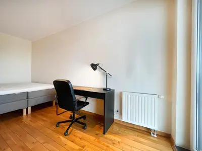 a bedroom with a desk and a bed and a chair at Apartment in cozy area for 4 guest, Cracow in Kraków