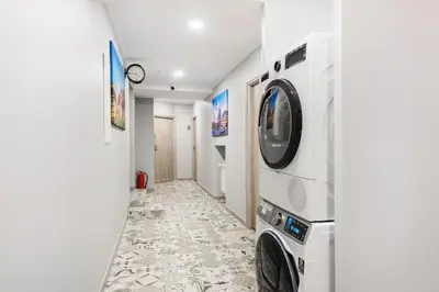 a laundry room with a washer and dryer at Underground Apartments by BookingHost in Kraków