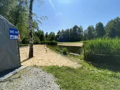 a person playing a game of frisbee in a yard at Zaskawie Apart in Wadowice