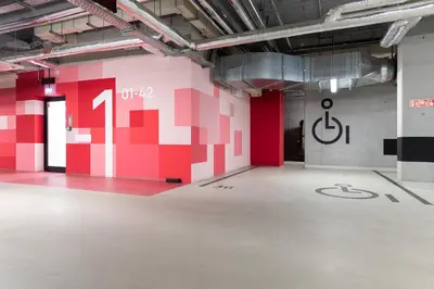 an empty room with a red and white wall at Apartment with private terrace by NEARTO PL in Kraków