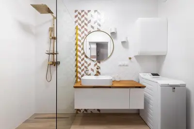 a bathroom with a sink and a mirror at Apartment with private terrace by NEARTO PL in Kraków