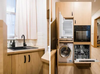 a kitchen with wooden cabinets and a black microwave at D21 Cozy Apartment Old Town Kazimierz 50m2 in Kraków