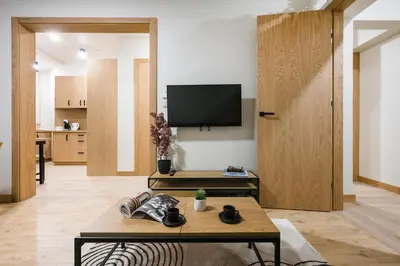 a bathroom with a toilet and a basket at D21 Cozy Apartment Old Town Kazimierz 50m2 in Kraków