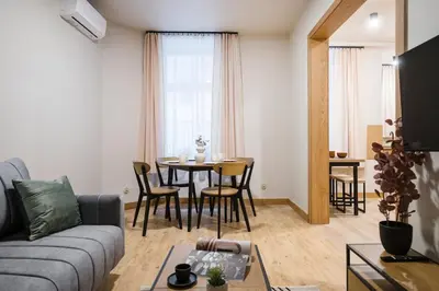 two pictures of a kitchen with two sinks at D21 Cozy Apartment Old Town Kazimierz 50m2 in Kraków