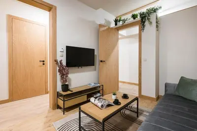 a kitchen with a washing machine and a washer at D21 Cozy Apartment Old Town Kazimierz 50m2 in Kraków
