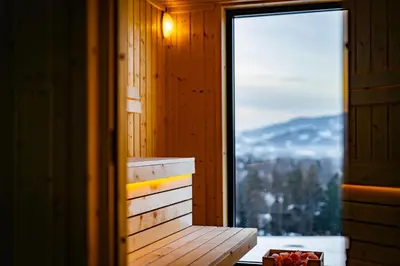 a bench in a room with a window at Domki Gasiówka in Jaworzna