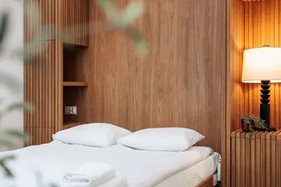 a bed with white pillows in a room at Stylowe Studio - Nowy Kleparz - Kraków - by Upstairs in Kraków
