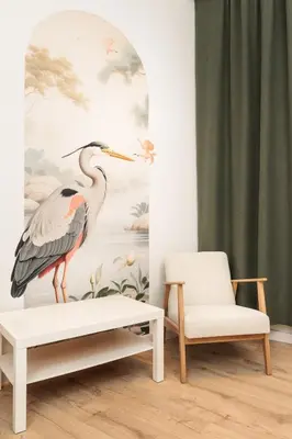 a living room with a painting of a bird on a wall at Felicjanek 15 - Central 3-Bedroom Apartment - by Upstairs in Kraków