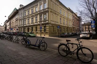 a row of bikes parked on the side of a street at Felicjanek 15 - Central 3-Bedroom Apartment - by Upstairs in Kraków