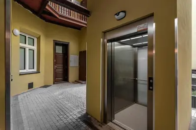an empty hallway with a door in a building at Felicjanek 15 - Central 3-Bedroom Apartment - by Upstairs in Kraków