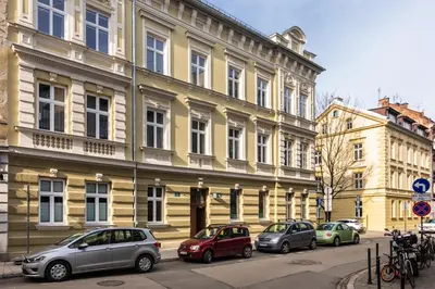 a row of cars parked in front of a building at Felicjanek 15 - Central 3-Bedroom Apartment - by Upstairs in Kraków