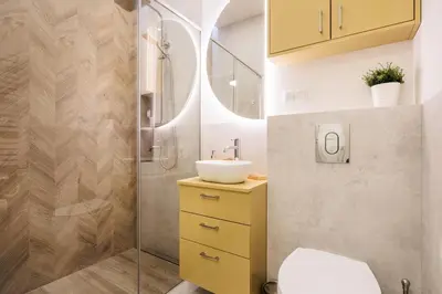 a bathroom with a sink and a shower at Felicjanek 15 - Central 3-Bedroom Apartment - by Upstairs in Kraków