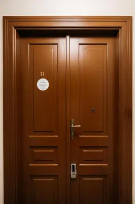 a wooden door with a sign on it at Native Apartments Brzozowa 15 in Kraków