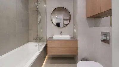 a bathroom with a sink and a mirror at Przedwiośnie, Sun & Snow in Kraków