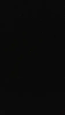 a dark room with a black background at Old town Apartment in Kraków