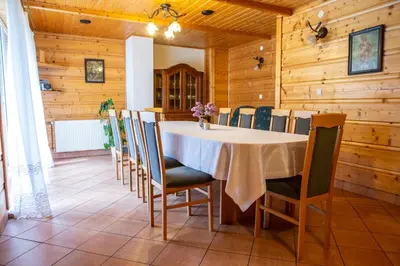 a dining room with a table and chairs at Pokoje Gościnne - Za Borem in Zubrzyca Górna