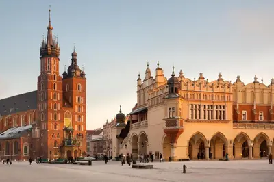 a group of buildings in a city with a clock tower at Twoje prywatne SPA - jacuzzi, sauna, tężnia solankowa in Kraków