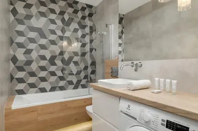 a bathroom with a sink and a toilet and a shower at Elegancki Apartament z Balkonem dla 4 osób by Noclegi Renters in Kraków