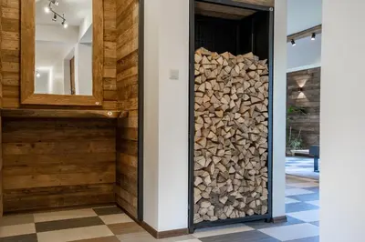 a stack of fire wood in a wall in a house at Górski Dom dla 30 osób z sauna oraz salą do integracji in Kocierz Rychwałdzki